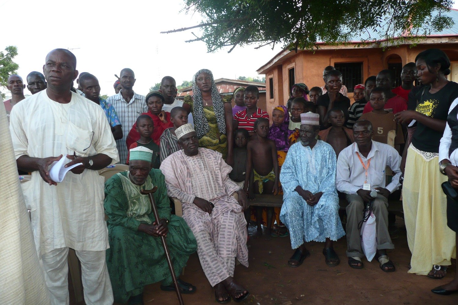 PPSDI officer engaging community elders and families during an outreach in Iyale, Kogi State